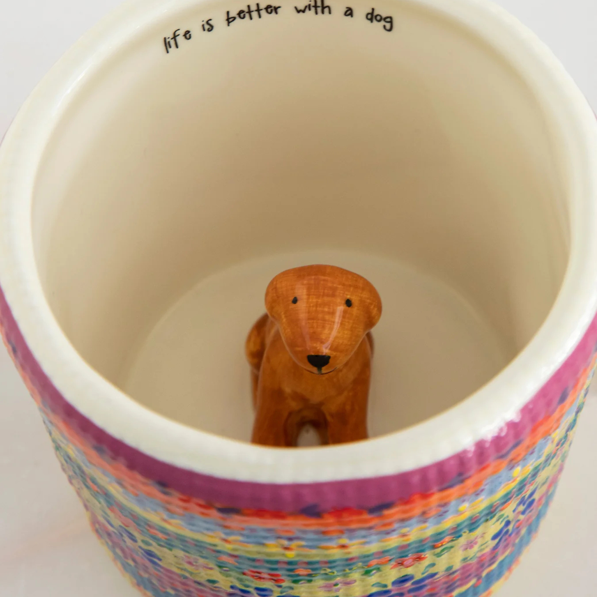 Natural Life Peek-A-Boo coffee mug featuring a playful dog design with vibrant colors and a unique shape.